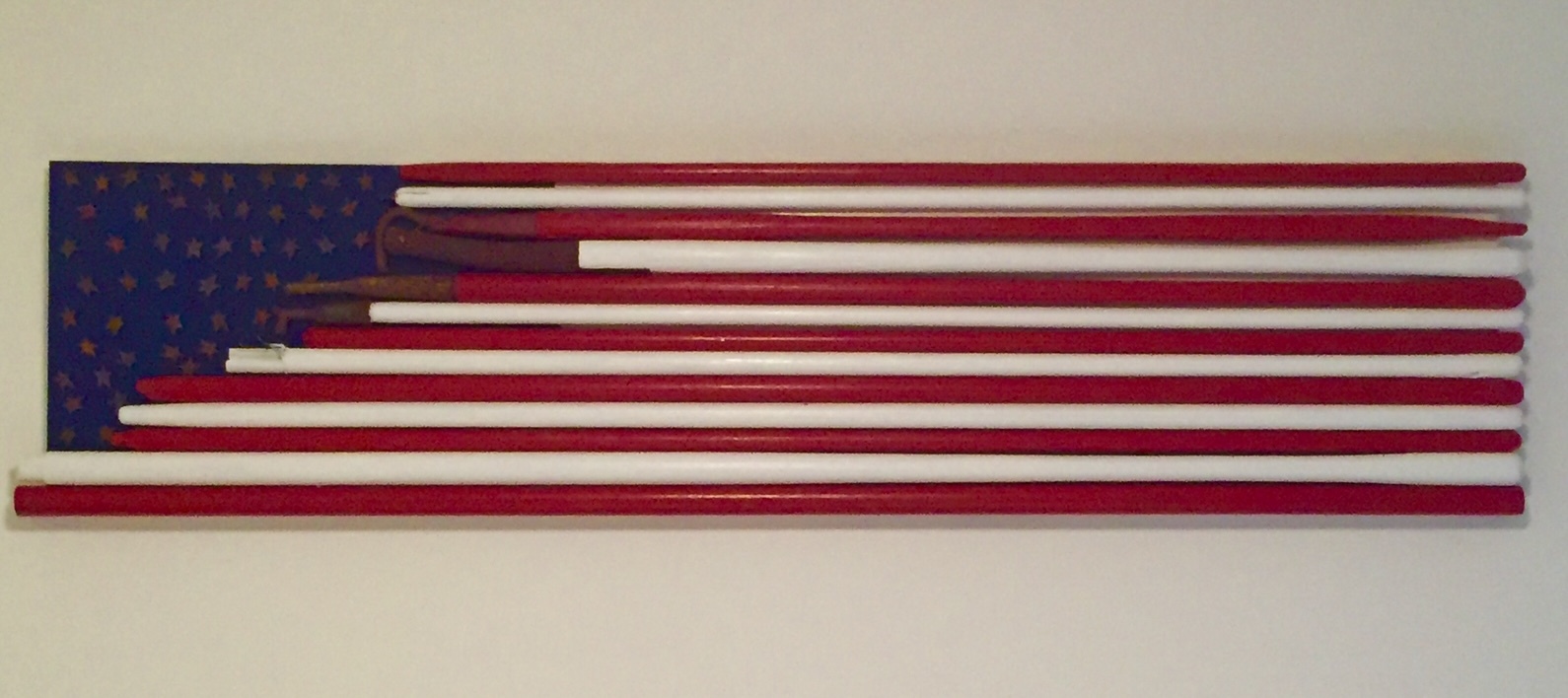 Long horizontal flag assemblage made with red and white rods