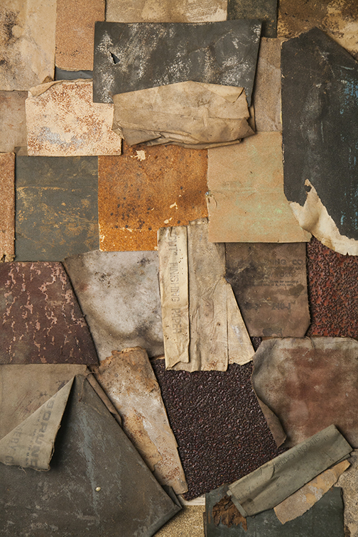 Layered close view of weathered fragments and assembled material surfaces